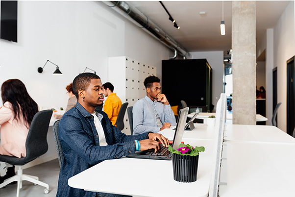 black men working on laptops