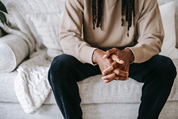 Man sitting on couch.